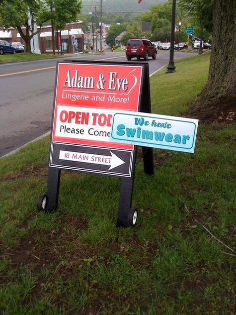 Adam and Eve: A-Frame with change out panel — specialty custom sign by Hale Custom Signs