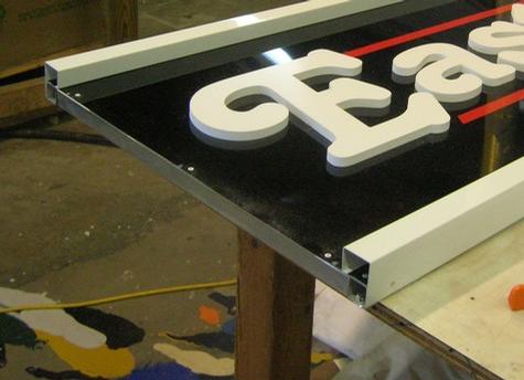 Aluminum Sign with Square Moulding — sign being fabricated on the bench by Hale Custom Signs