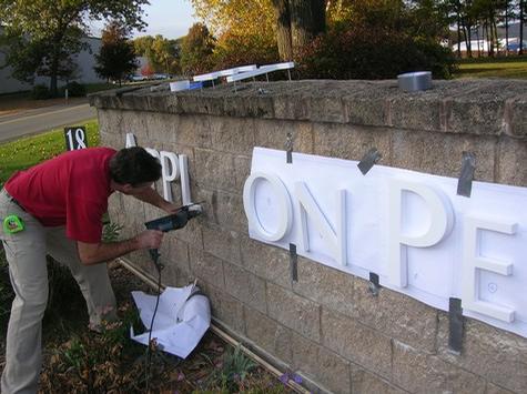Installing Dimensional Letters — sign being fabricated on the bench by Hale Custom Signs