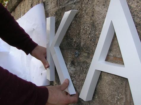 Installing Dimensional Letters — sign being fabricated on the bench by Hale Custom Signs