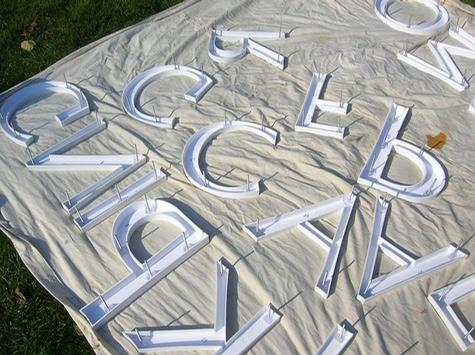 Installing Dimensional Letters — sign being fabricated on the bench by Hale Custom Signs