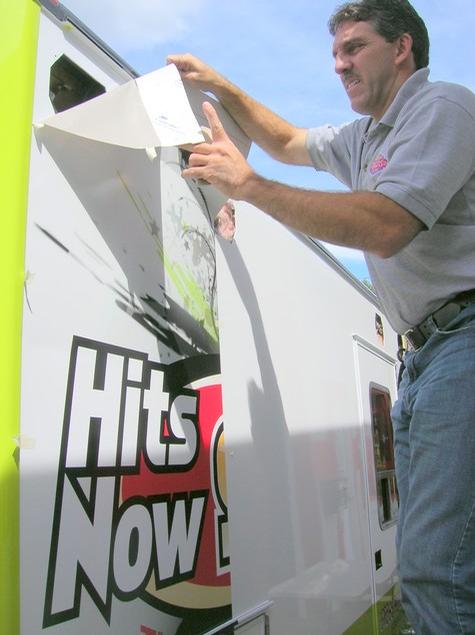 Hits Now 94.3 — sign being fabricated on the bench by Hale Custom Signs