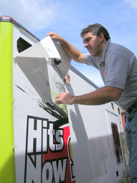 Hits Now 94.3 — sign being fabricated on the bench by Hale Custom Signs