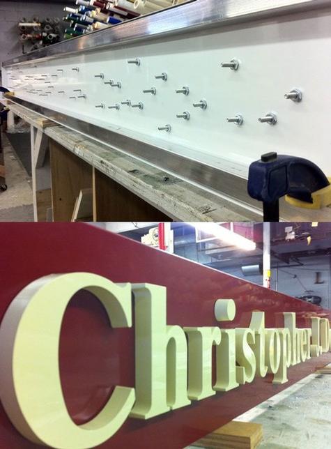 Studded Letters on a Pan face — sign being fabricated on the bench by Hale Custom Signs