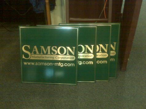 Brushed brass multiple signs — trade show display by Hale Custom Signs
