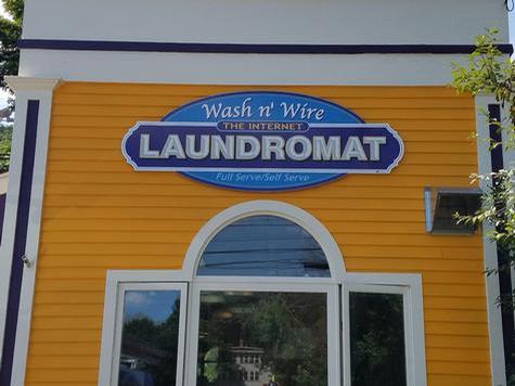 Wash N Wire Laundromat-Shaped PVC wall sign — wall-mounted building sign by Hale Custom Signs