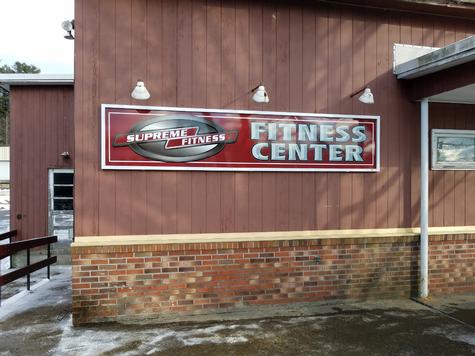 Supreme Fitness-aluminum wall sign with frame moldings — wall-mounted building sign by Hale Custom Signs