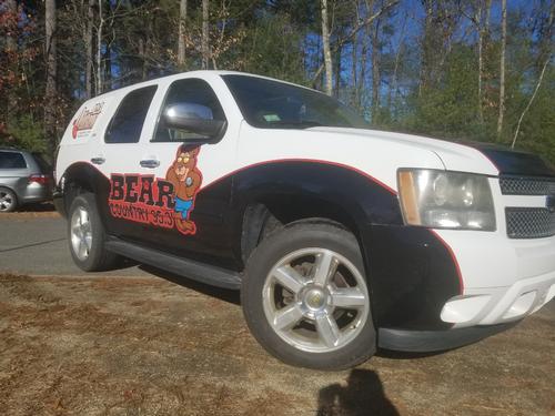 Bear Country and The Outlaw Radio Station partial wrap — vehicle graphics installation by Hale Custom Signs