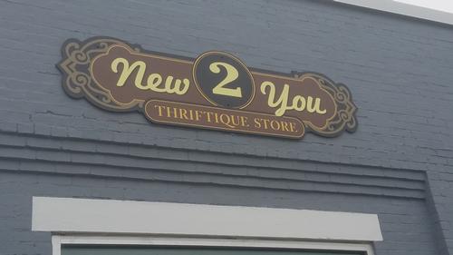 PVC wall sign cut to custom shape, printed graphics — wall-mounted building sign by Hale Custom Signs